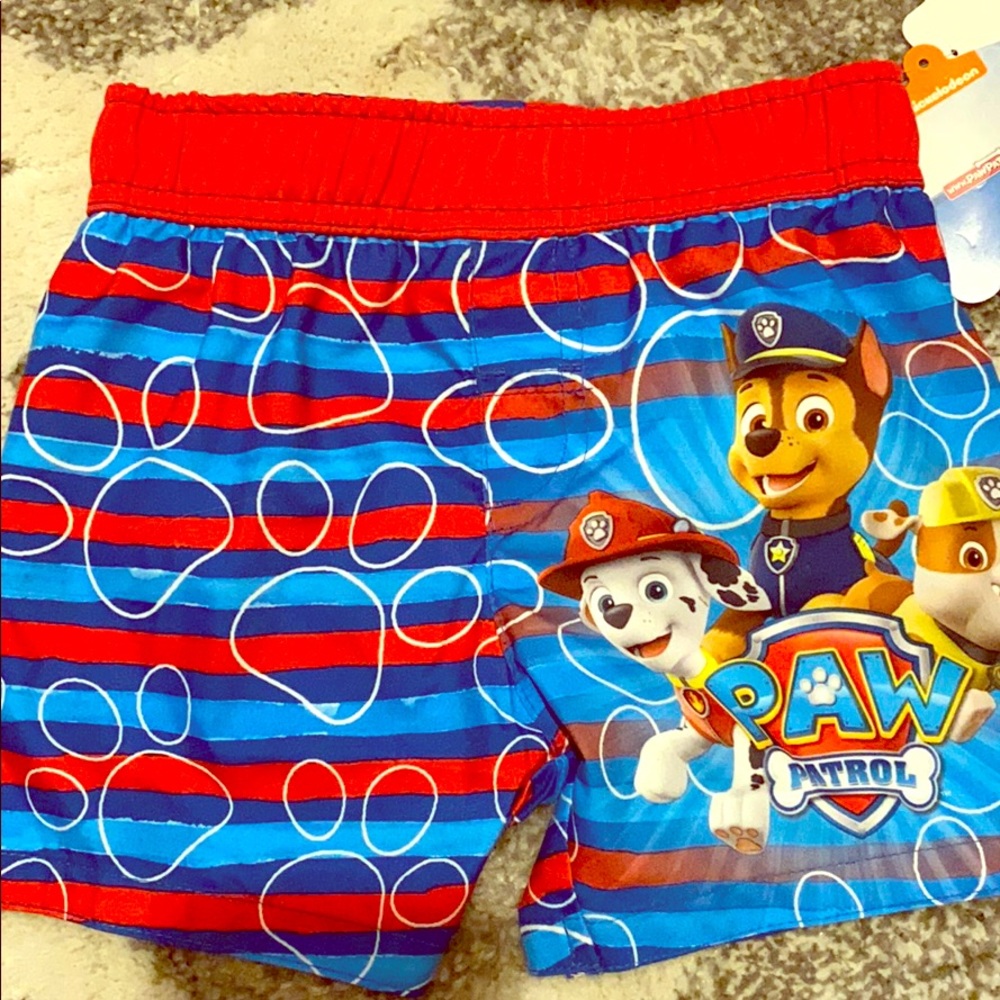 Boys swim trunks and sun hat